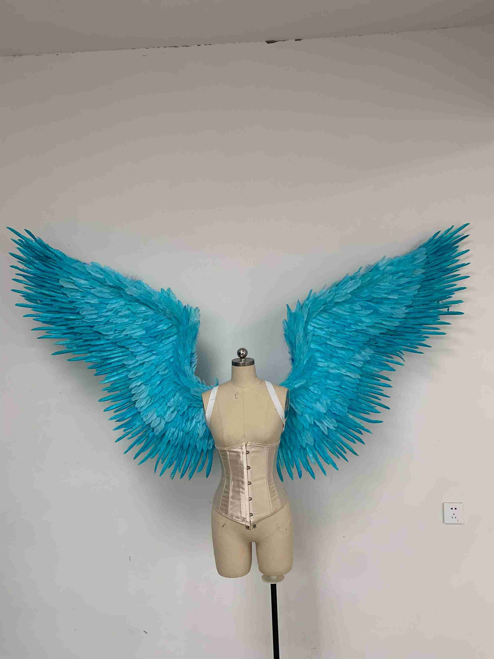 Our blue color angel wings from the front. Made from goose feathers. Wings for angel costume or devil costume. Suitable for photoshoots.