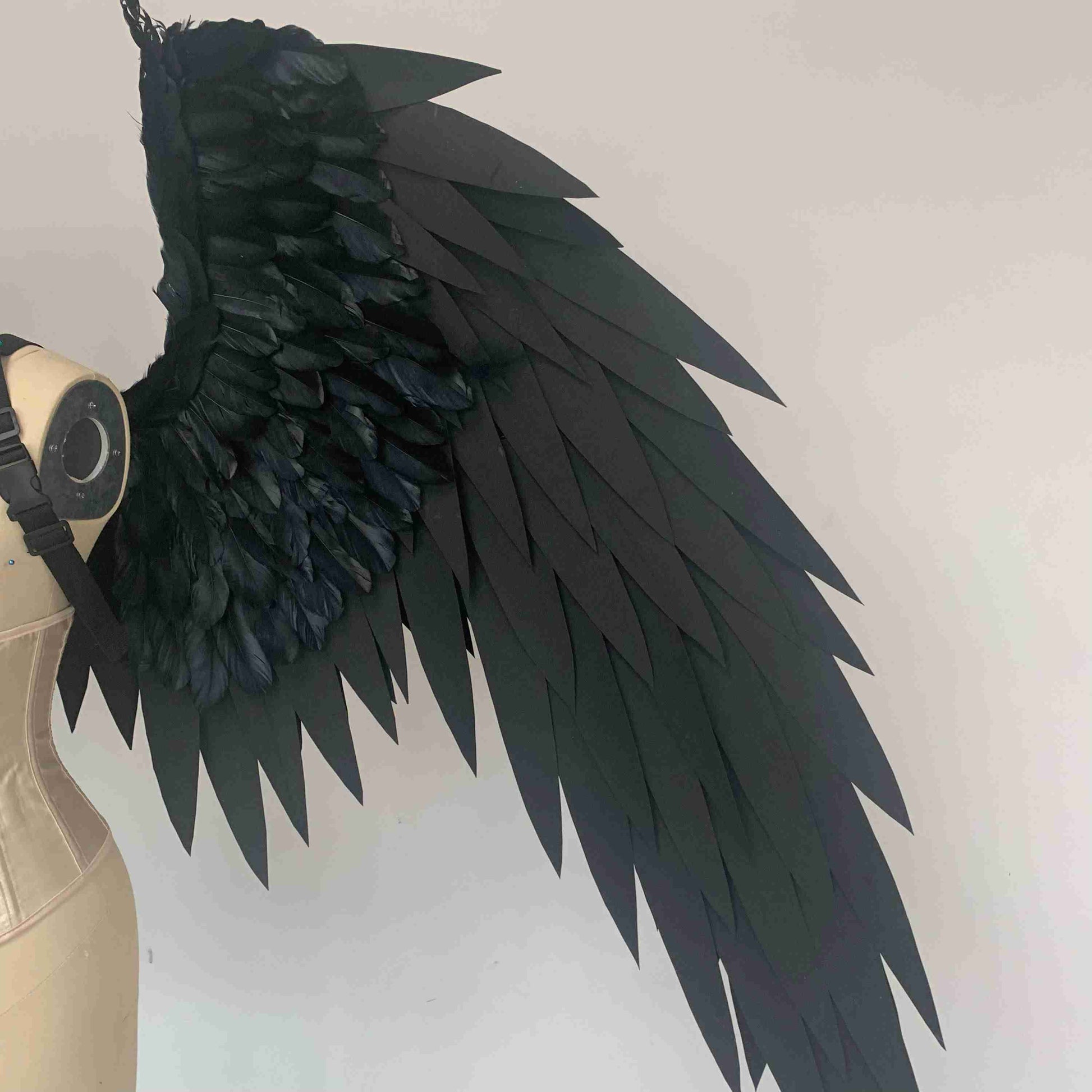 Our black color angel wings close view. Made from EVA foam and goose feathers. Wings for angel costume or devil costume. Suitable for photoshoots.