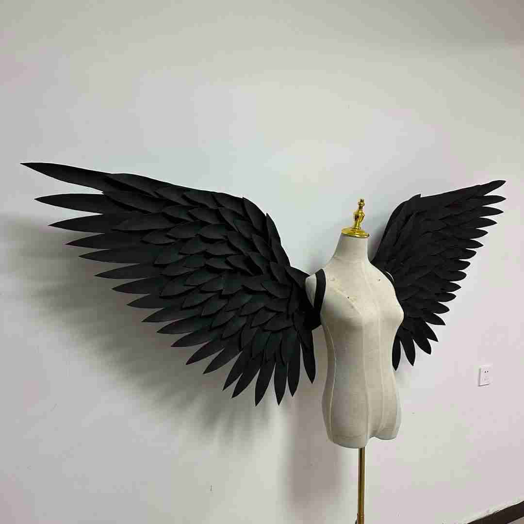 Our black angel wings from the right side. Made from EVA foam feathers. Wings for angel wings costume or devil wings costume. Suitable for photoshoots.
