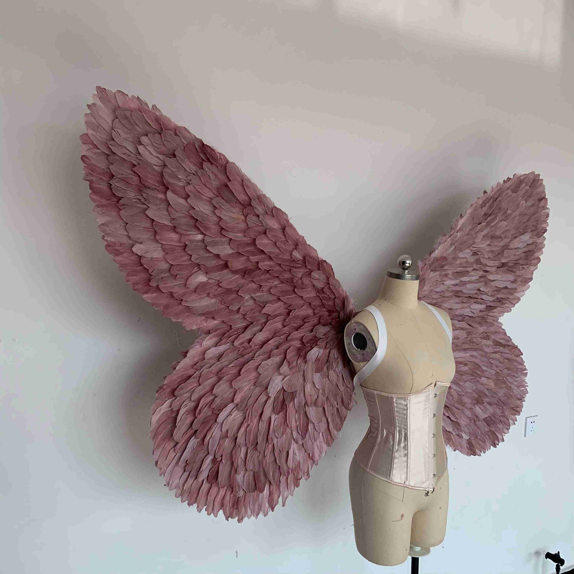Our purple color butterfly wings from the right side. Made from goose feathers. Wings for butterfly, pixie, and fairy costumes. Suitable for photoshoots.