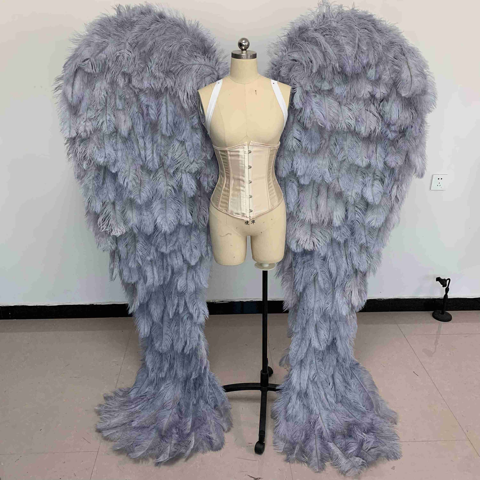 Our luxury gray angel wings from the front. Made from ostrich feathers. Wings for angel costume. Suitable for photoshoots especially for boudoirs.