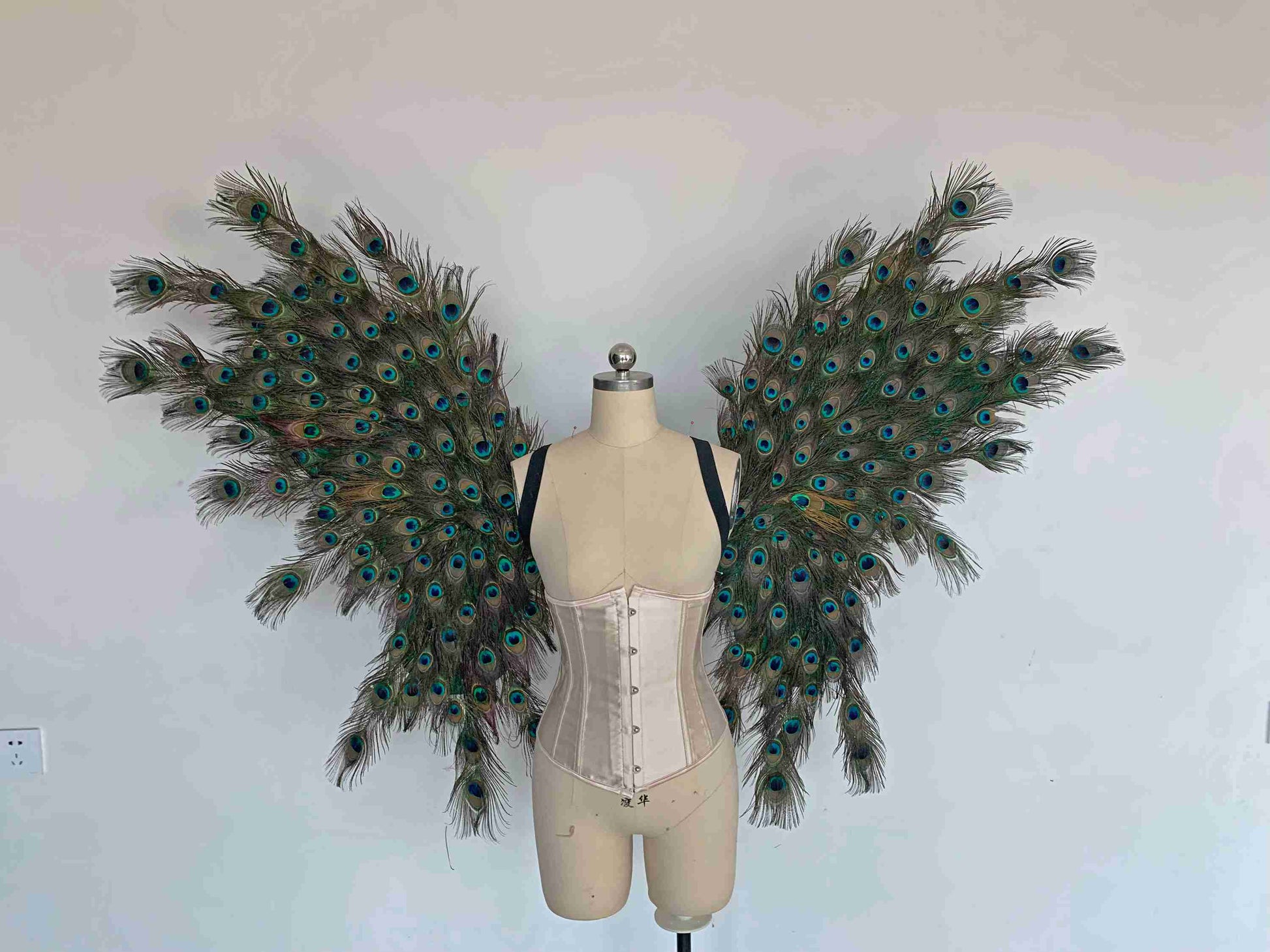 Our angel wings from the front. Made from peacock feathers. Wings for peacock costume or fantasy costume. Suitable for photoshoots.