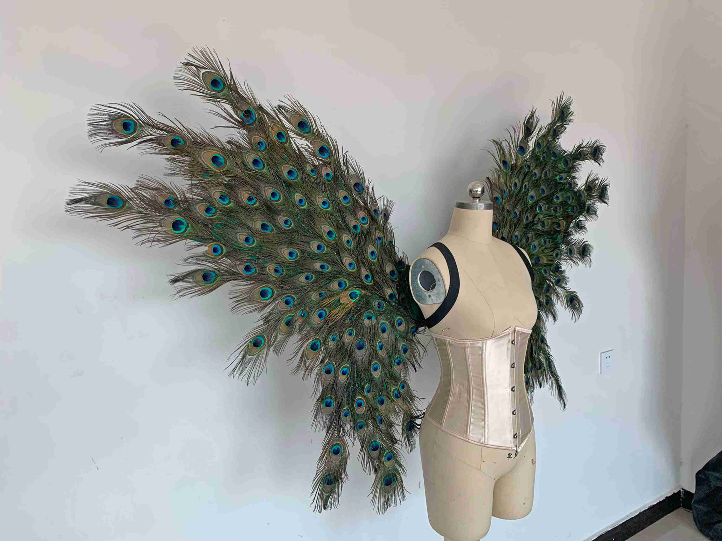 Our angel wings from the right side. Made from peacock feathers. Wings for peacock costume or fantasy costume. Suitable for photoshoots.