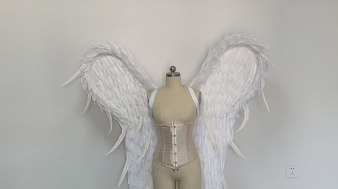 Our white color angel wings video. Made from goose feathers. Wings for the devil or angel costume. Suitable for photoshoots.
