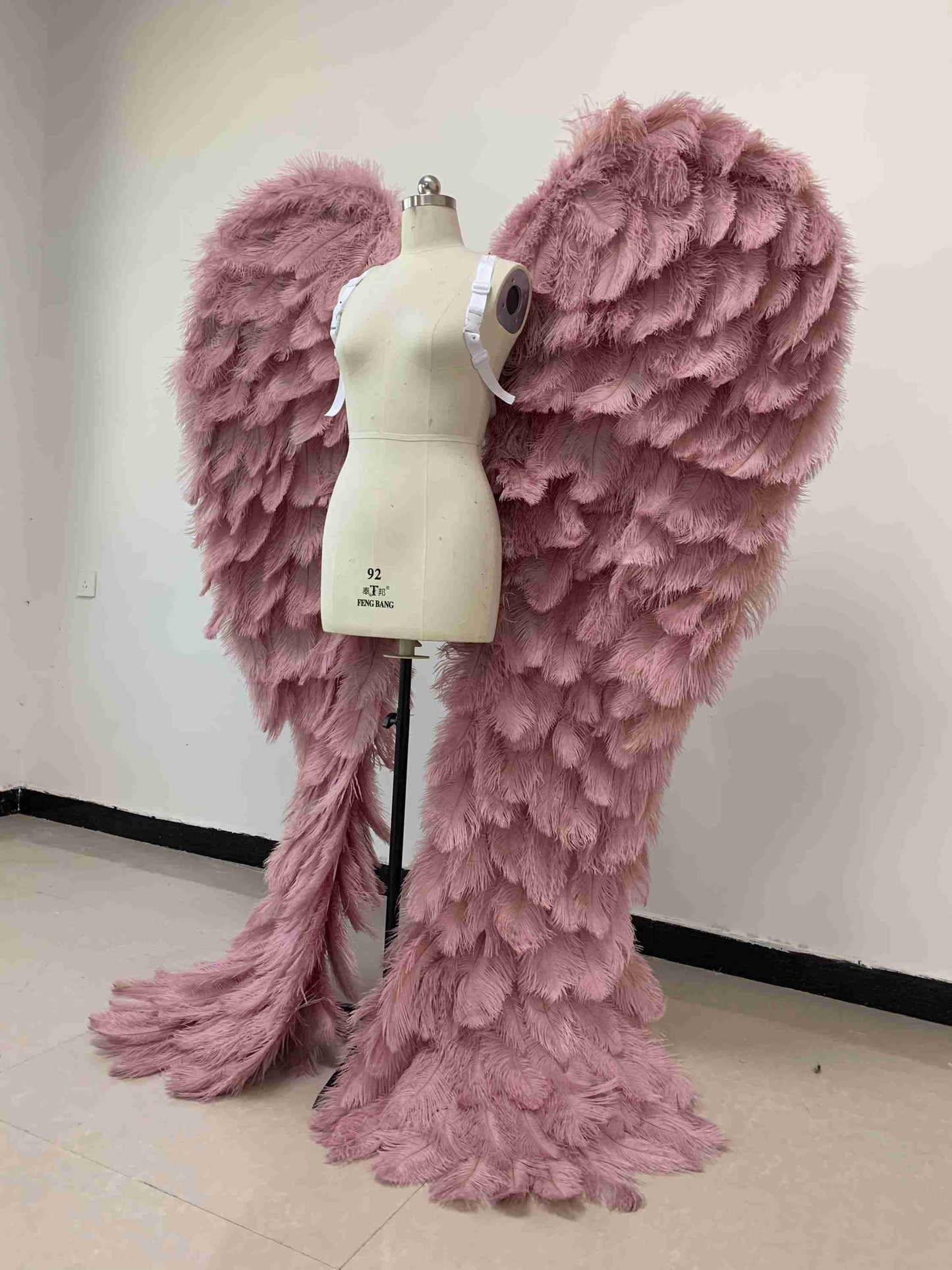 Our luxury purple angel wings from the left side. Made from ostrich feathers. Wings for angel costume. Suitable for photoshoots especially for boudoirs.