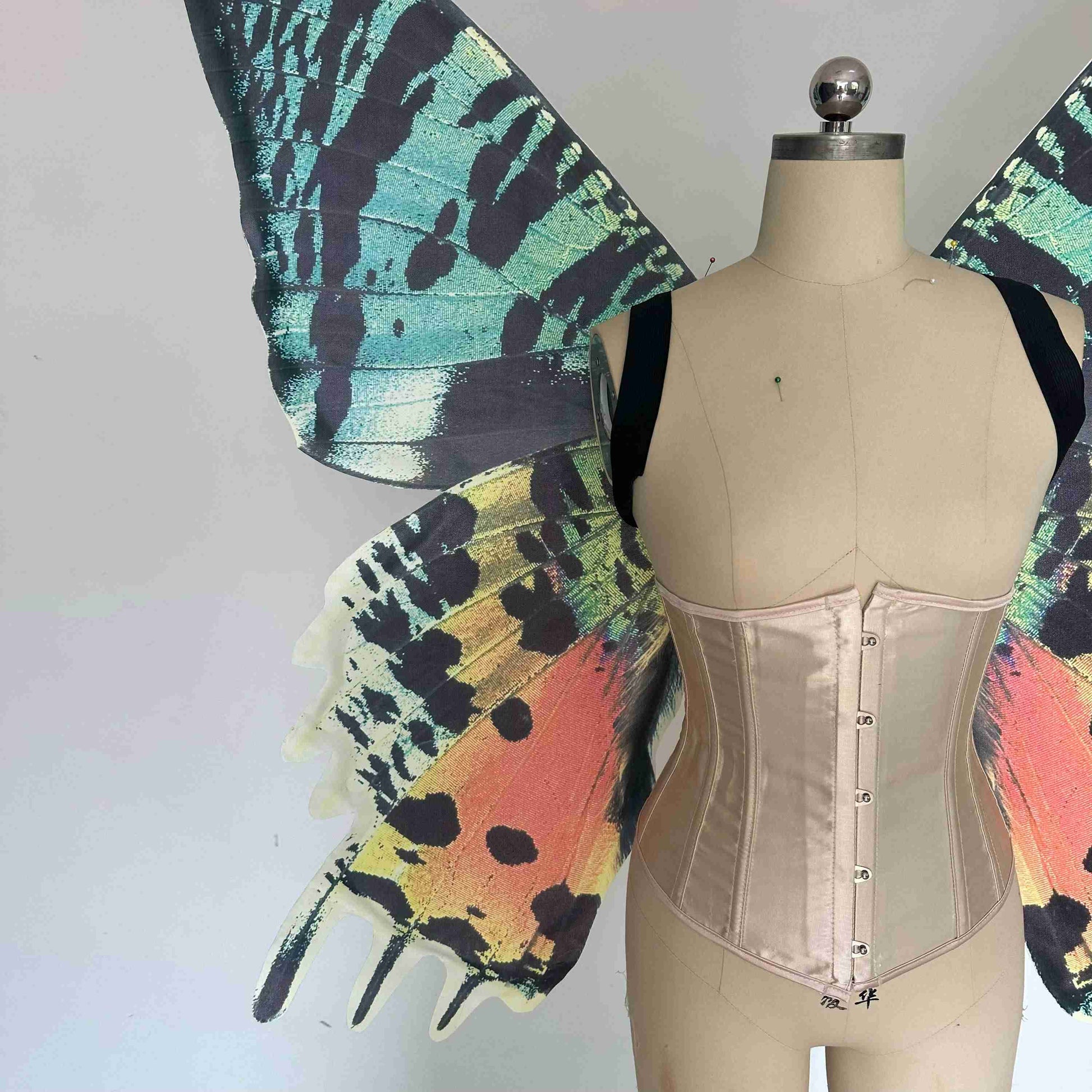 Our sky orange butterfly wings from the close view. Made from cloth. Can be also named fairy wings or pixie wings.