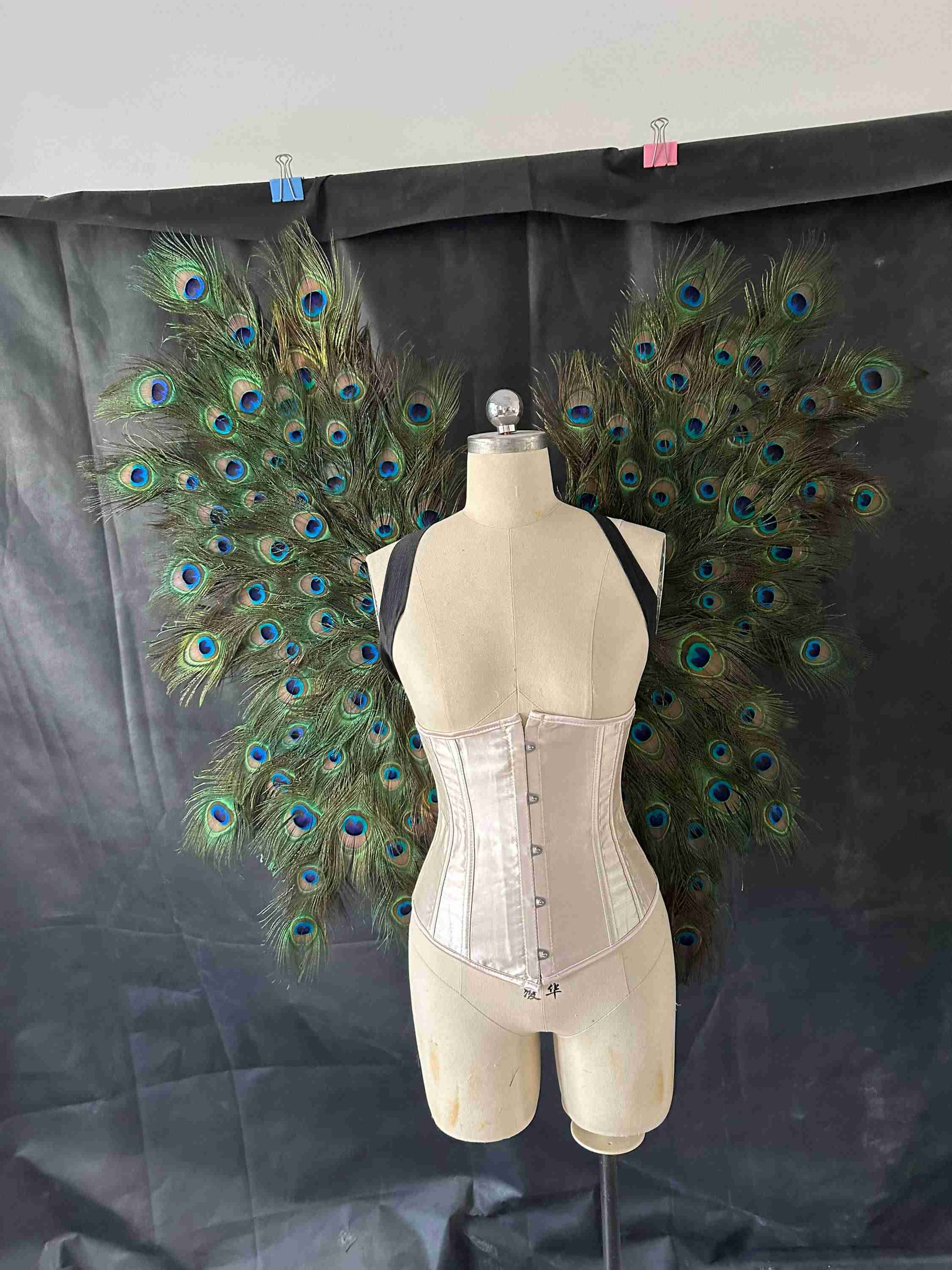 Our small peacock wings from the front. Made from peacock feathers. Wings for angel costume or fantasy costume. Suitable for photoshoots.