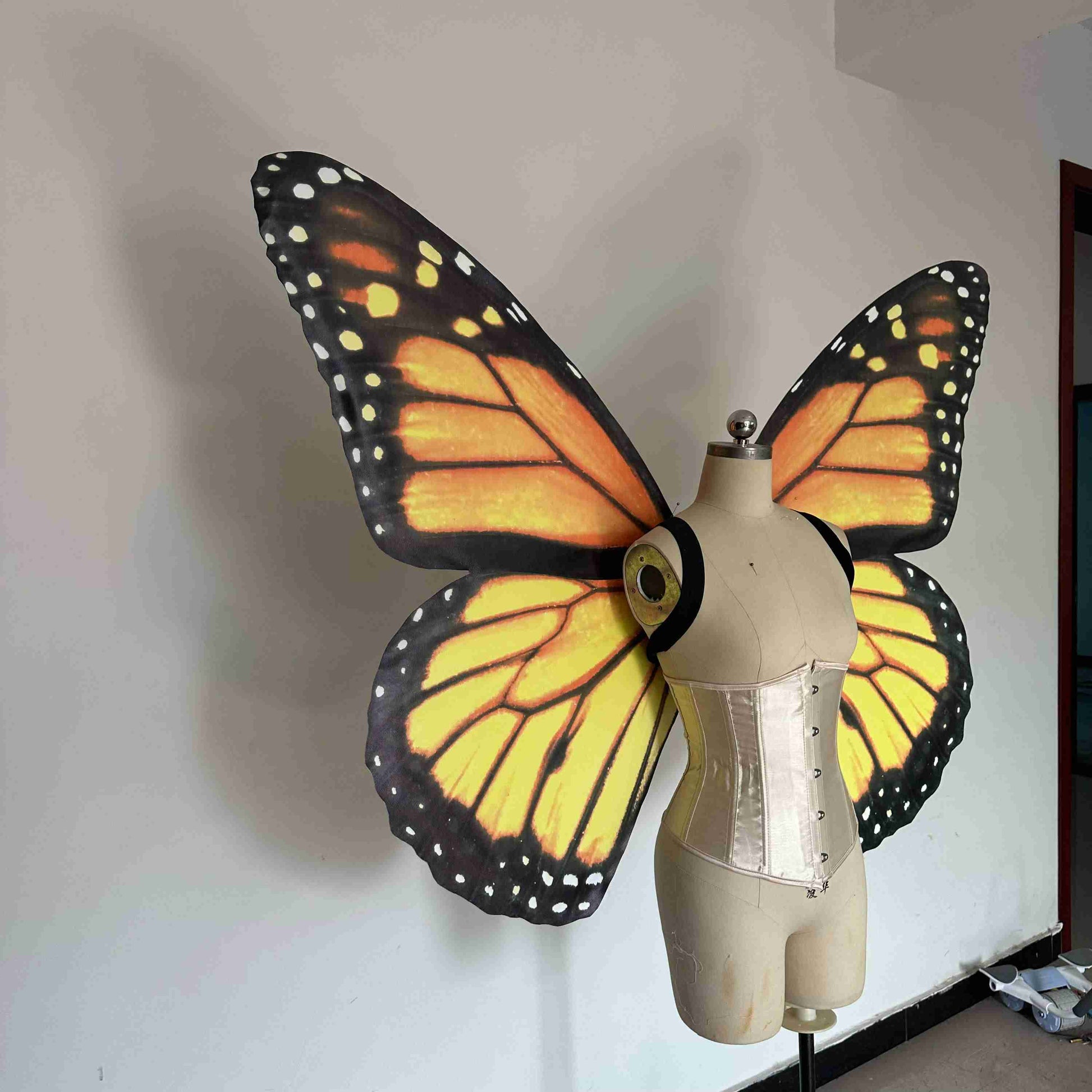 Our yellow black butterfly wings from the right side. Made from cloth. Can be also named fairy wings or pixie wings.