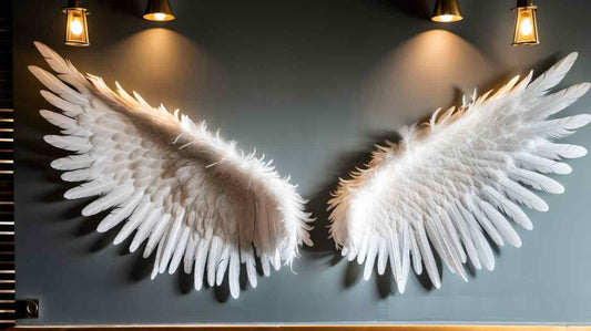 white angel wings from feathers on the wall as decoration