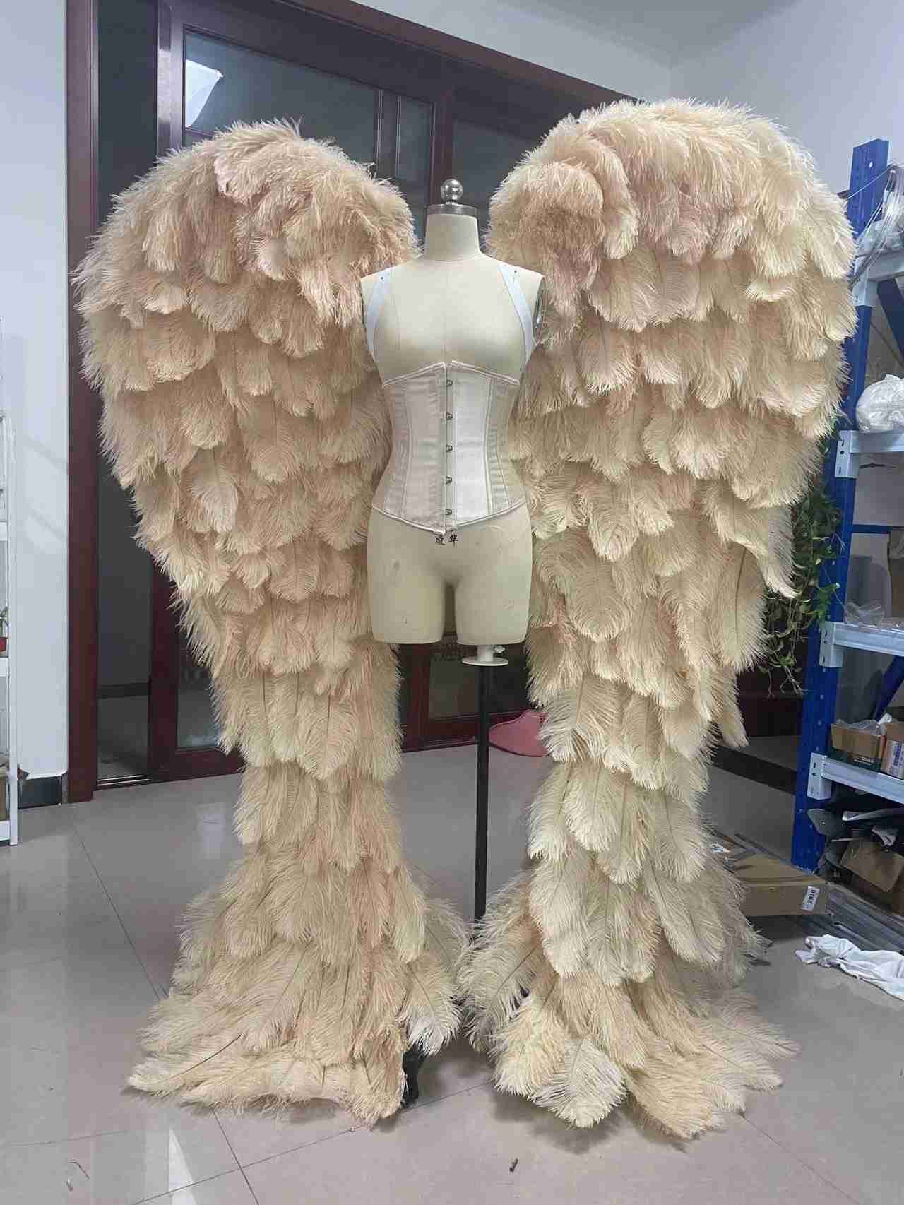 Our luxury beige angel wings from the front. Made from ostrich feathers. Wings for angel costume. Suitable for photoshoots especially for boudoirs.