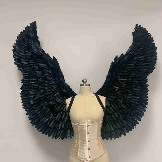 Our black color devil wings from the front. Made from goose feathers. Wings for the devil or angel costume. Suitable for photoshoots.