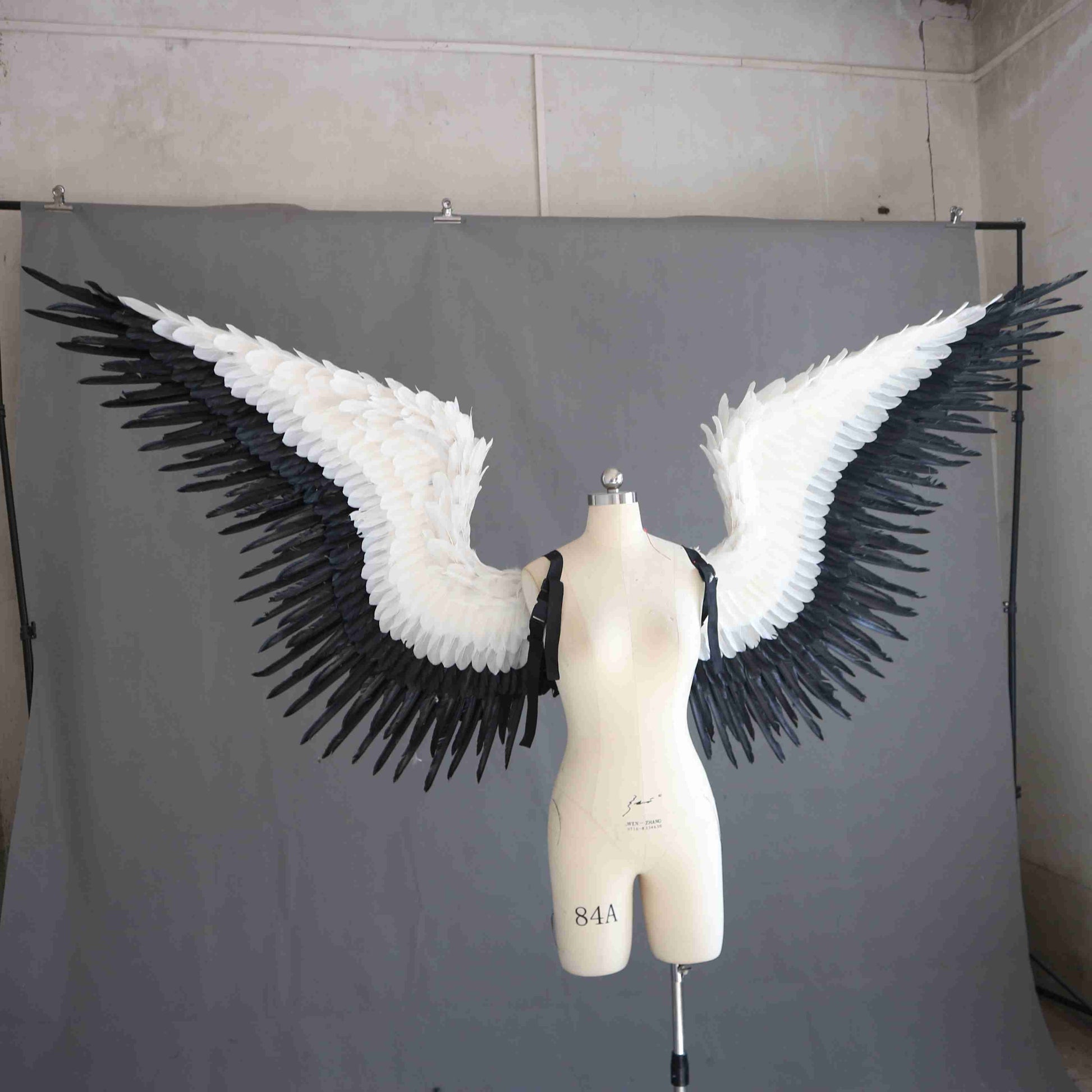 Our black white angel wings from the right. Made from goose feathers. Wings for angel wings costume or devil wings costume. Suitable for photoshoots.
