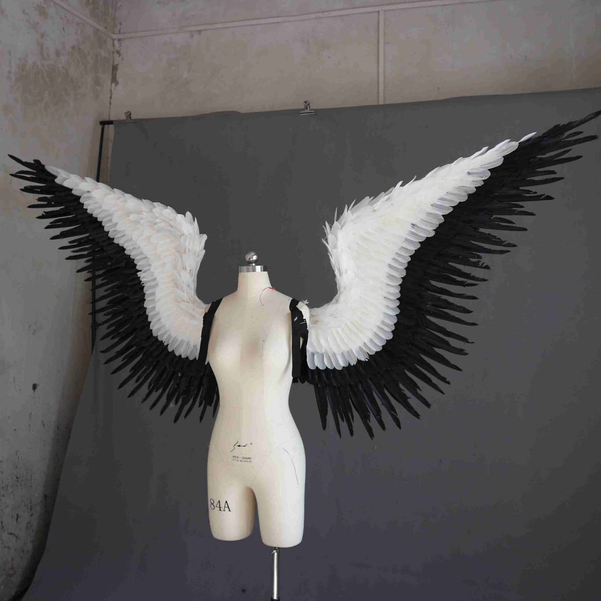 Our black white angel wings from the left. Made from goose feathers. Wings for angel wings costume or devil wings costume. Suitable for photoshoots.