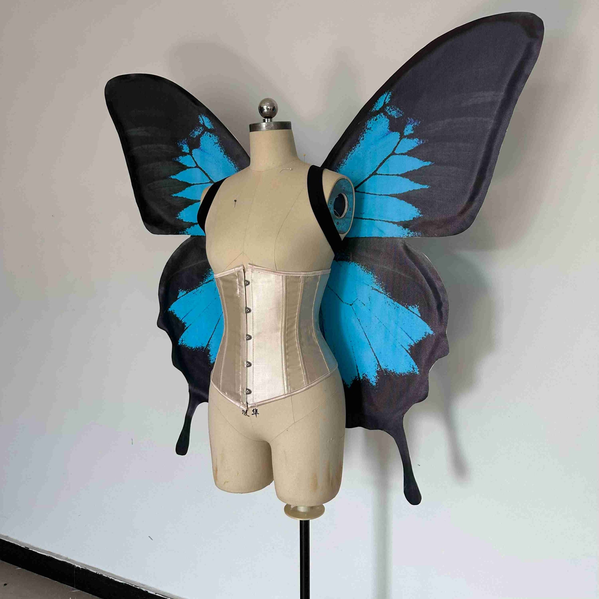Our blue black butterfly wings from the left. Made from cloth. Can be also named fairy wings or pixie wings.