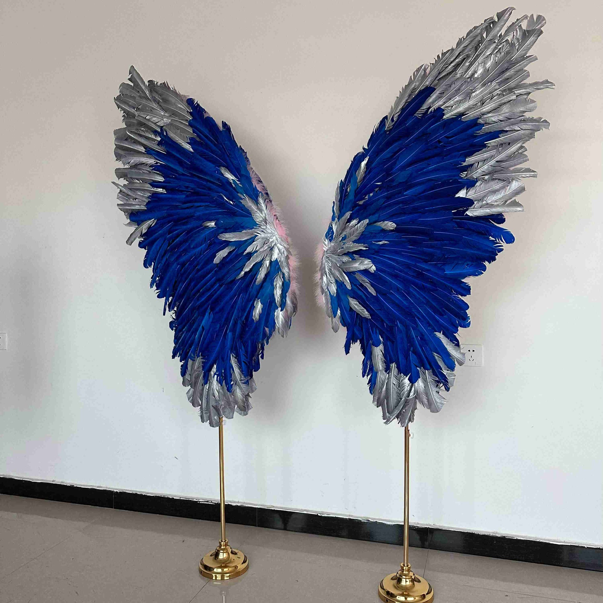 Our silver blue angel wings on poles from the left side. Made from goose feathers. Wings for decoration. Suitable for restaurant, cafe, night club, event decorations.