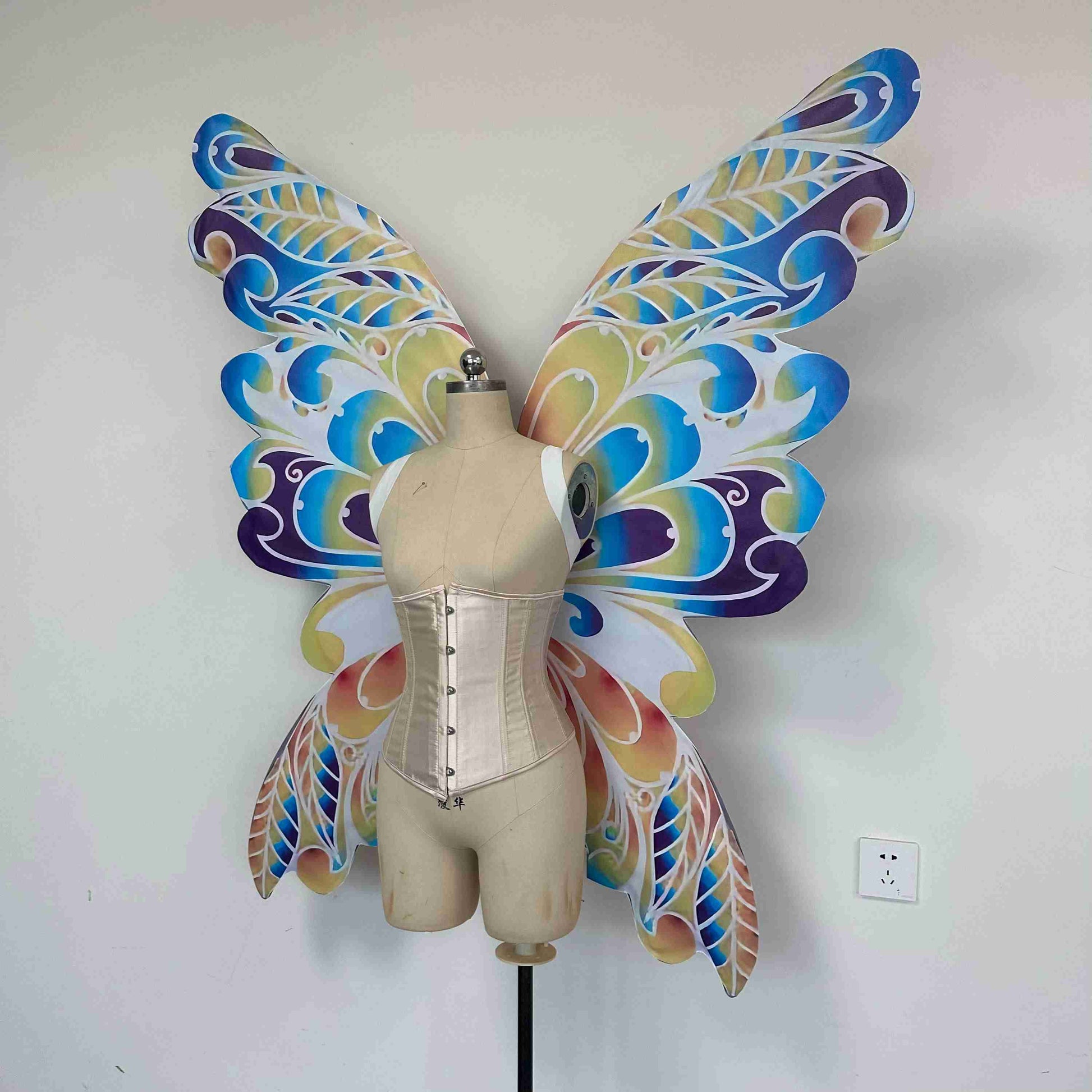 Our colorful dream butterfly wings from the left side. Made from cloth. Can be also named fairy wings or pixie wings.