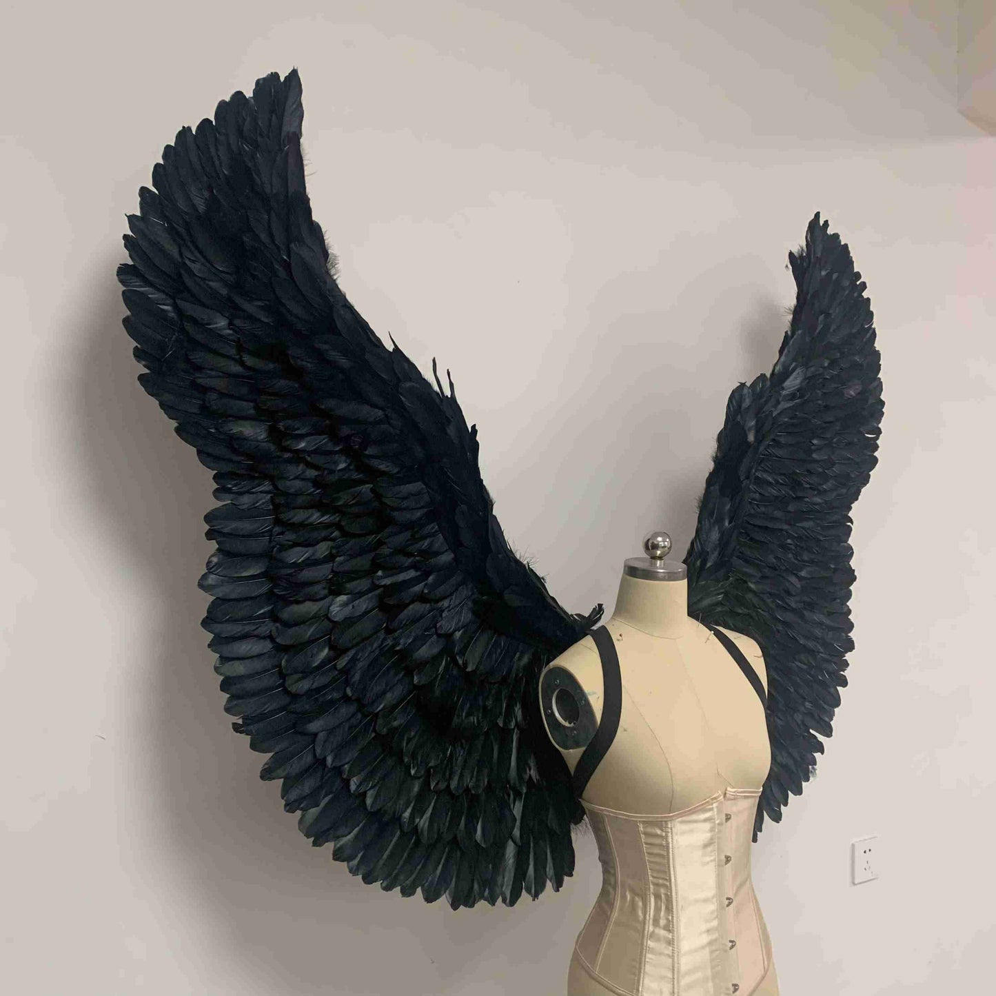 Our black color devil wings from the right side. Made from goose feathers. Wings for the devil or angel costume. Suitable for photoshoots.