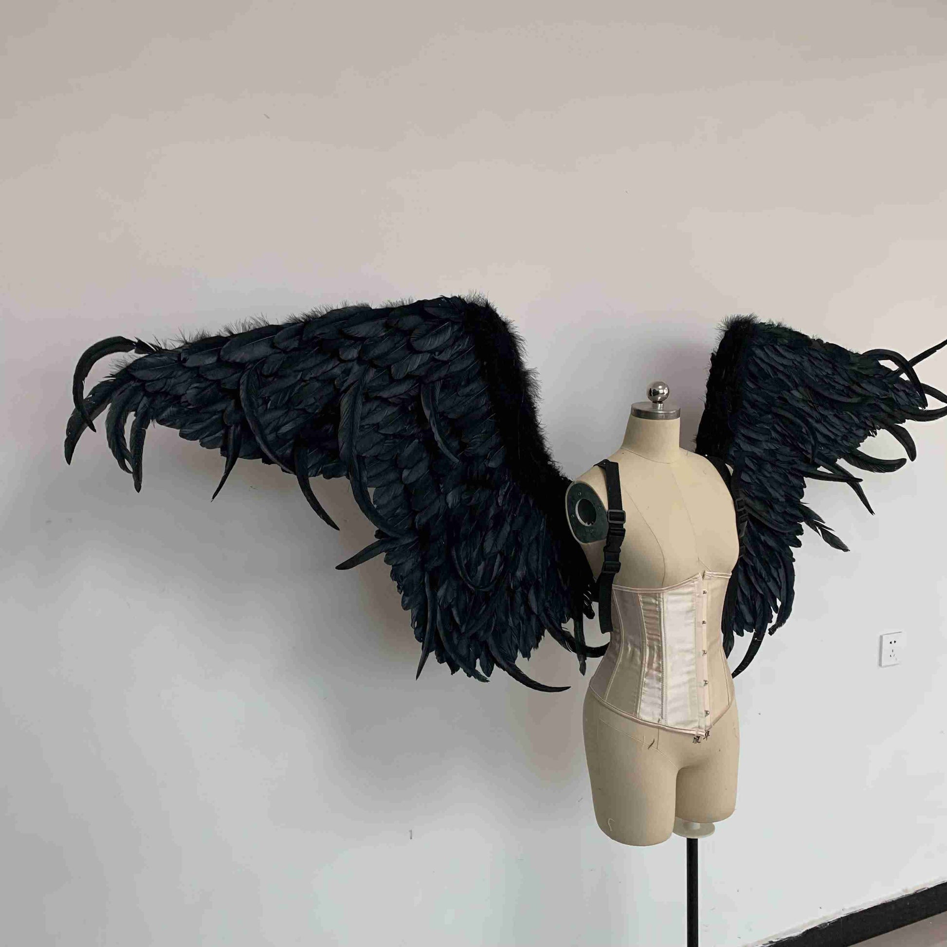 Our black color demon wings from the right side. Made from goose feathers. Wings for angel costume or devil costume. Suitable for photoshoots.