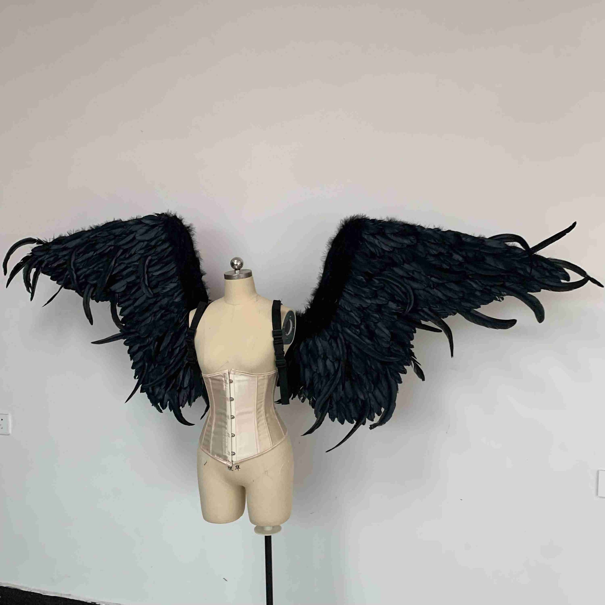 Our black color demon wings from the left side. Made from goose feathers. Wings for angel costume or devil costume. Suitable for photoshoots.