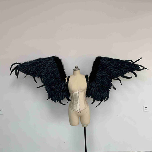 Our black color demon wings from the front. Made from goose feathers. Wings for angel costume or devil costume. Suitable for photoshoots.