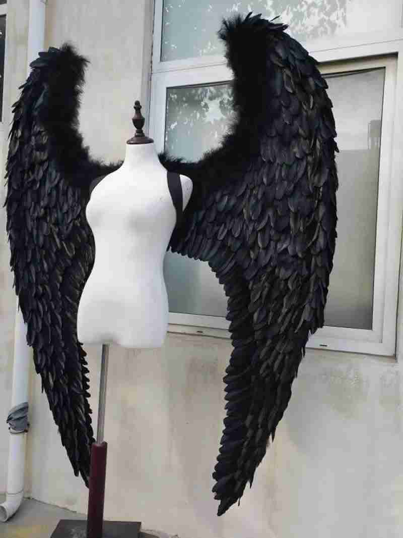 Our dark angel wings from the left side. Made from goose feathers. Wings for angel costume or devil costume. Suitable for photoshoots.