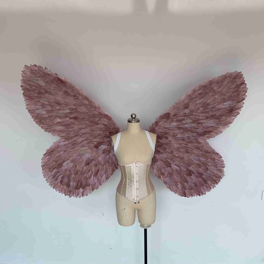 Our purple color butterfly wings from the front. Made from goose feathers. Wings for butterfly, pixie, and fairy costumes. Suitable for photoshoots.