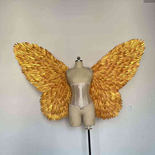 Our golden color butterfly wings from the front. Made from goose feathers. Wings for butterfly, pixie, and fairy costumes. Suitable for photoshoots.