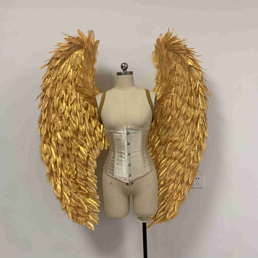 Our golden color angel wings from the front. Made from goose feathers. Wings for angel costume. Suitable for photoshoots.