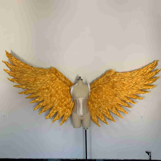 Our big golden angel wings from the front. Made from goose feathers. Wings for angel costume. Suitable for photoshoots.