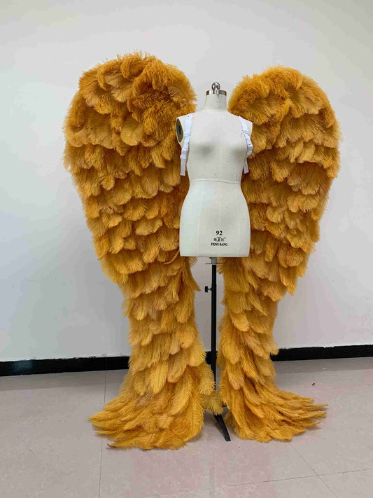 Our luxury golden angel wings from the front. Made from ostrich feathers. Wings for angel costume. Suitable for photoshoots especially for boudoirs.