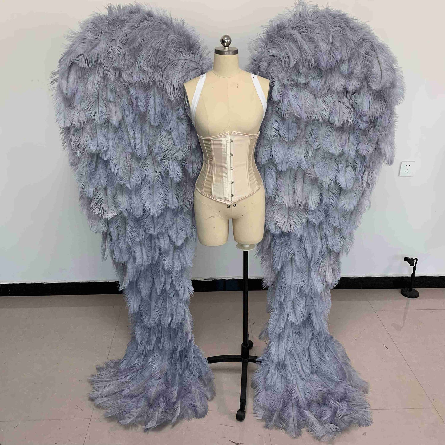 Our luxury gray angel wings from the front. Made from ostrich feathers. Wings for angel costume. Suitable for photoshoots especially for boudoirs.