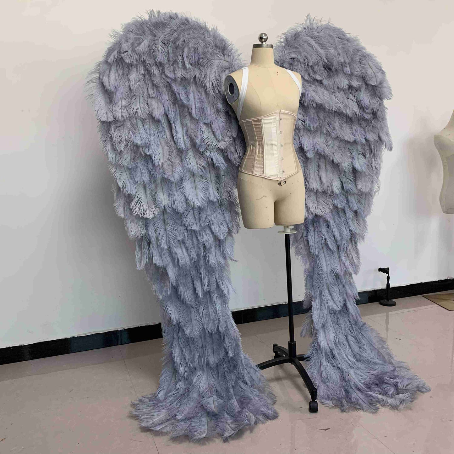 Our luxury gray angel wings from the right side. Made from ostrich feathers. Wings for angel costume. Suitable for photoshoots especially for boudoirs.
