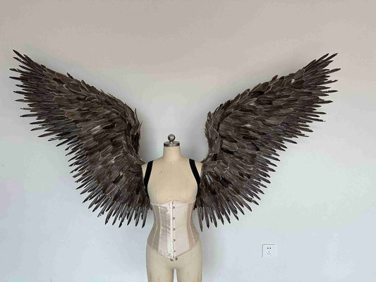 Our grey color angel wings from the front. Made from goose feathers. Wings for angel costume or devil costume. Suitable for photoshoots.