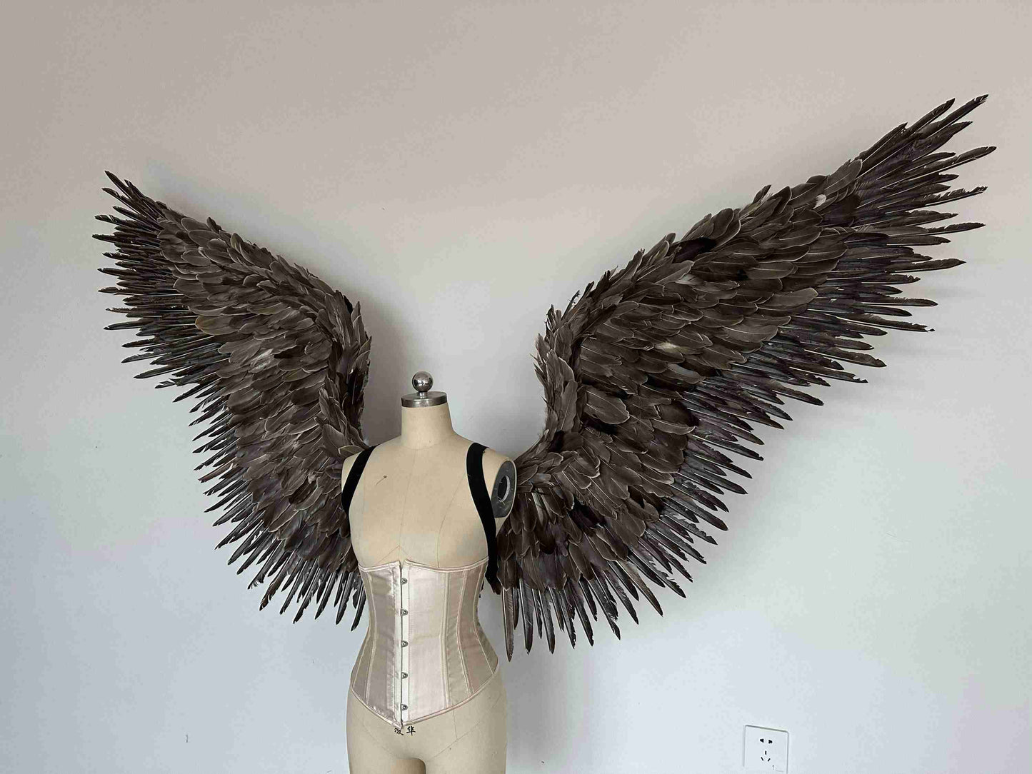Our grey color angel wings from the center. Made from goose feathers. Wings for angel costume or devil costume. Suitable for photoshoots.