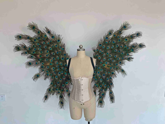 Our angel wings from the front. Made from peacock feathers. Wings for peacock costume or fantasy costume. Suitable for photoshoots.