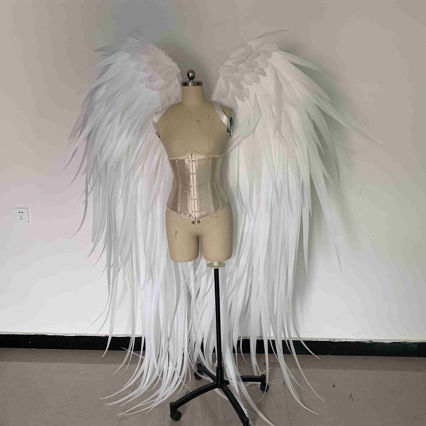Our white angel wings from the front. Made from pearl cotton foam and some goose feathers. Wings for angel costume. Suitable for photoshoots.