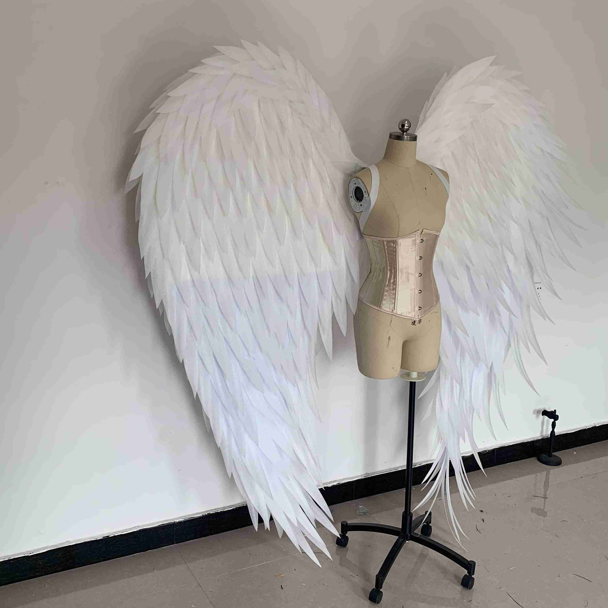 Our white angel wings from the right side. Made from pearl cotton foam. Wings for angel costume. Suitable for photoshoots.