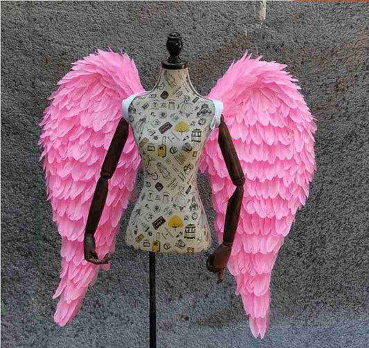 Our little pink color angel wings from the front. Made from goose feathers. Wings for angel costume. Suitable for photoshoots.