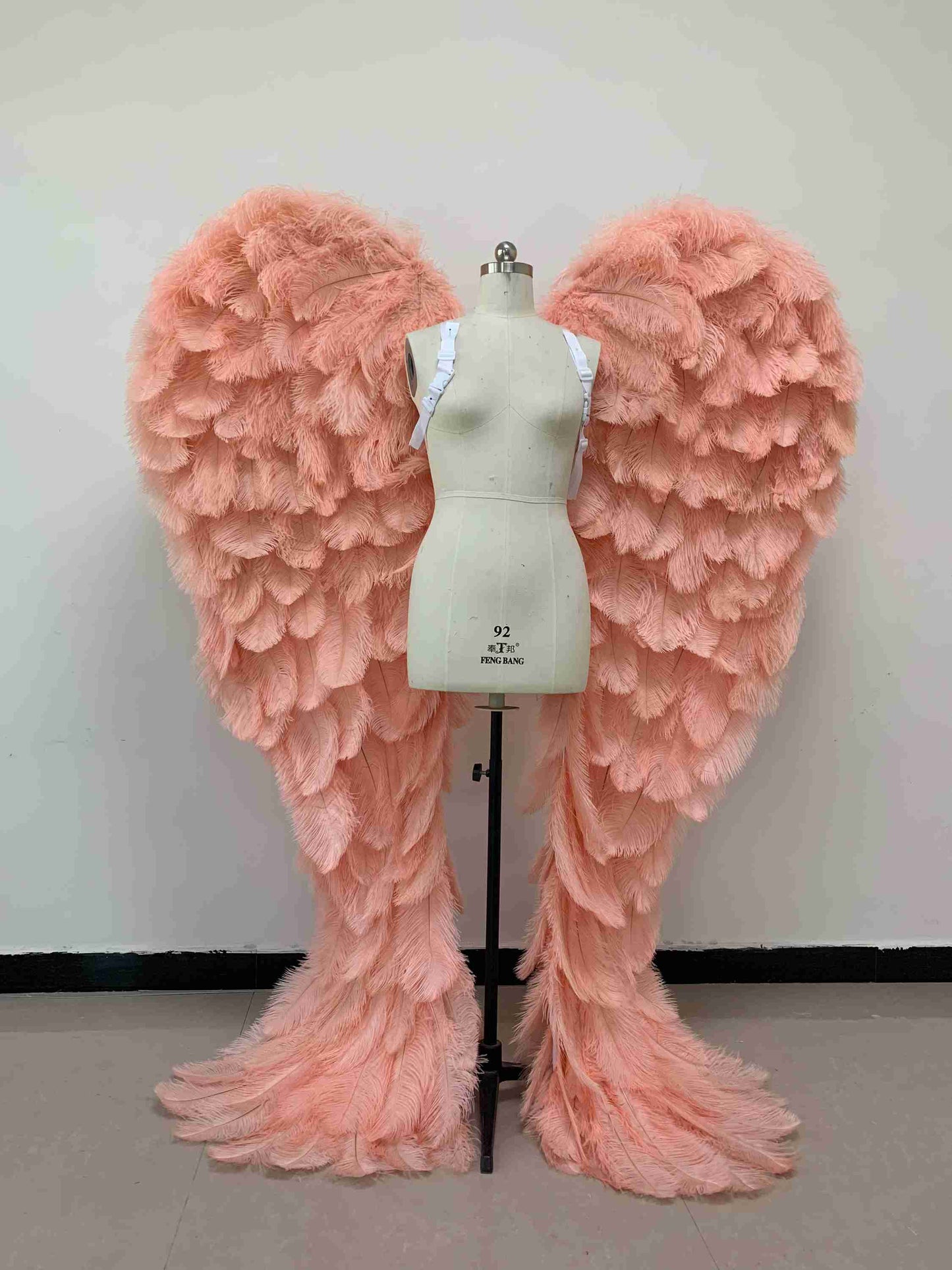 Our luxury pink angel wings from the front. Made from ostrich feathers. Wings for angel costume. Suitable for photoshoots especially for boudoirs.