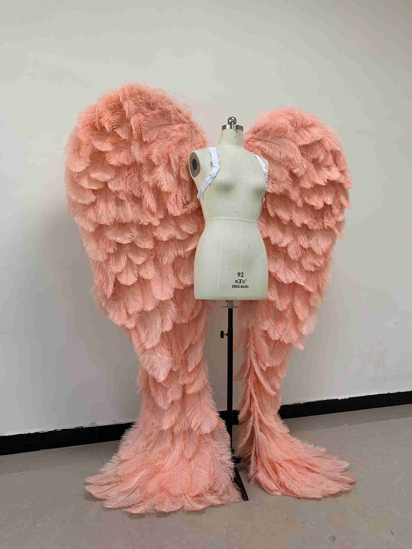 Our luxury pink angel wings from the right side. Made from ostrich feathers. Wings for angel costume. Suitable for photoshoots especially for boudoirs.