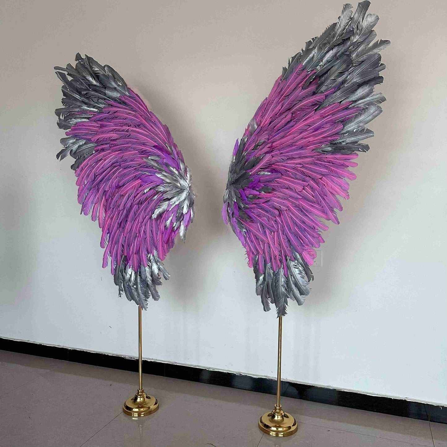 Our silver pink angel wings on poles from the left side. Made from goose feathers. Wings for decoration. Suitable for restaurant, cafe, night club, event decorations.