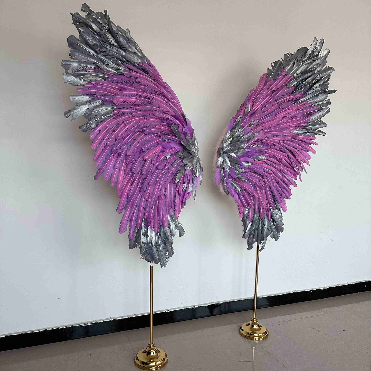 Our silver pink angel wings on poles from the right side. Made from goose feathers. Wings for decoration. Suitable for restaurant, cafe, night club, event decorations.