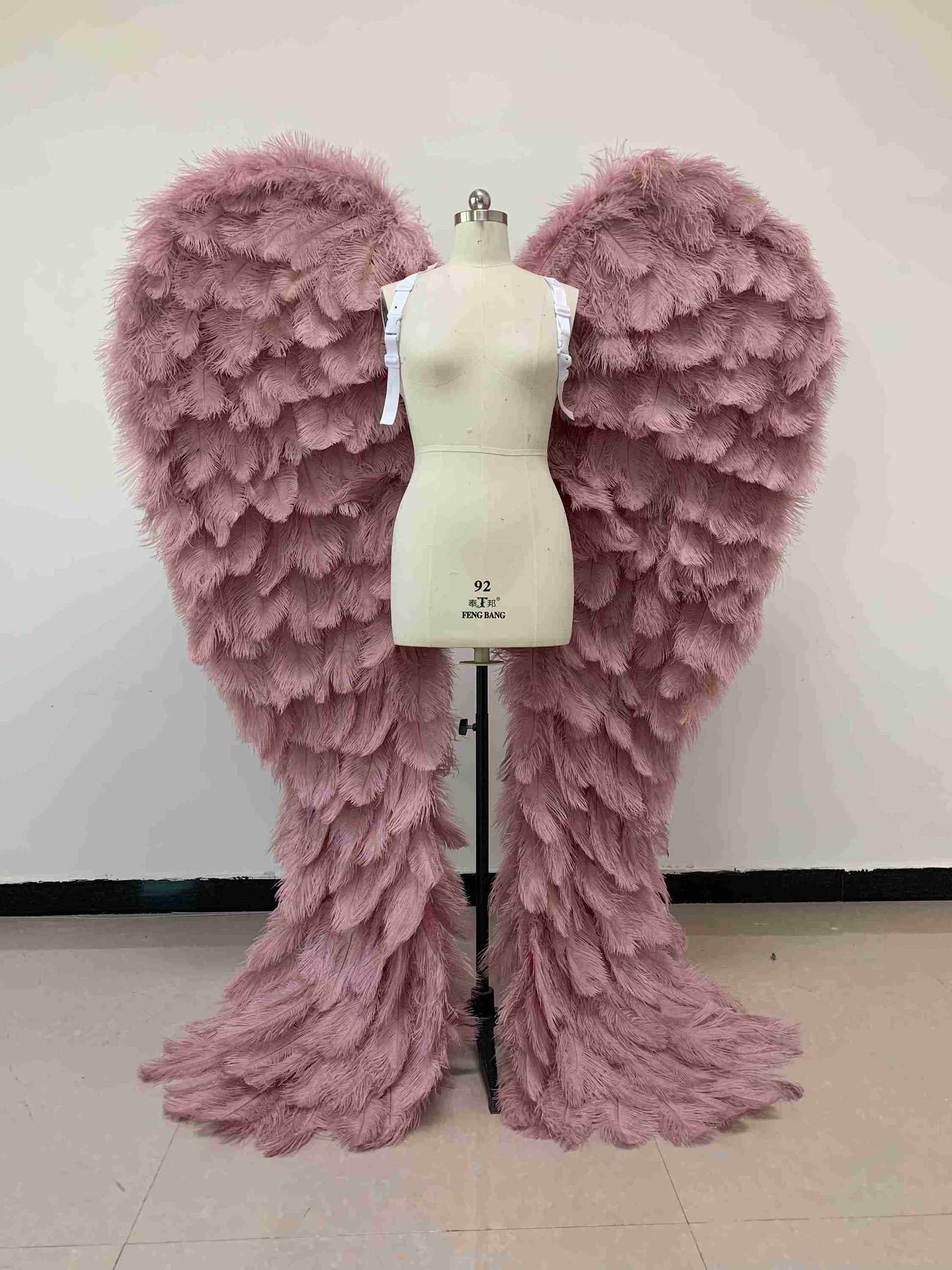 Our luxury purple angel wings from the front. Made from ostrich feathers. Wings for angel costume. Suitable for photoshoots especially for boudoirs.
