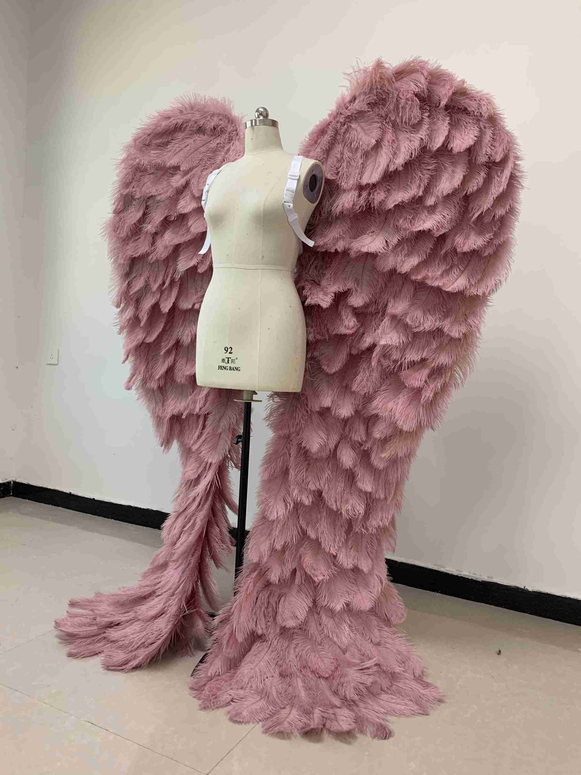 Our luxury purple angel wings from the left side. Made from ostrich feathers. Wings for angel costume. Suitable for photoshoots especially for boudoirs.