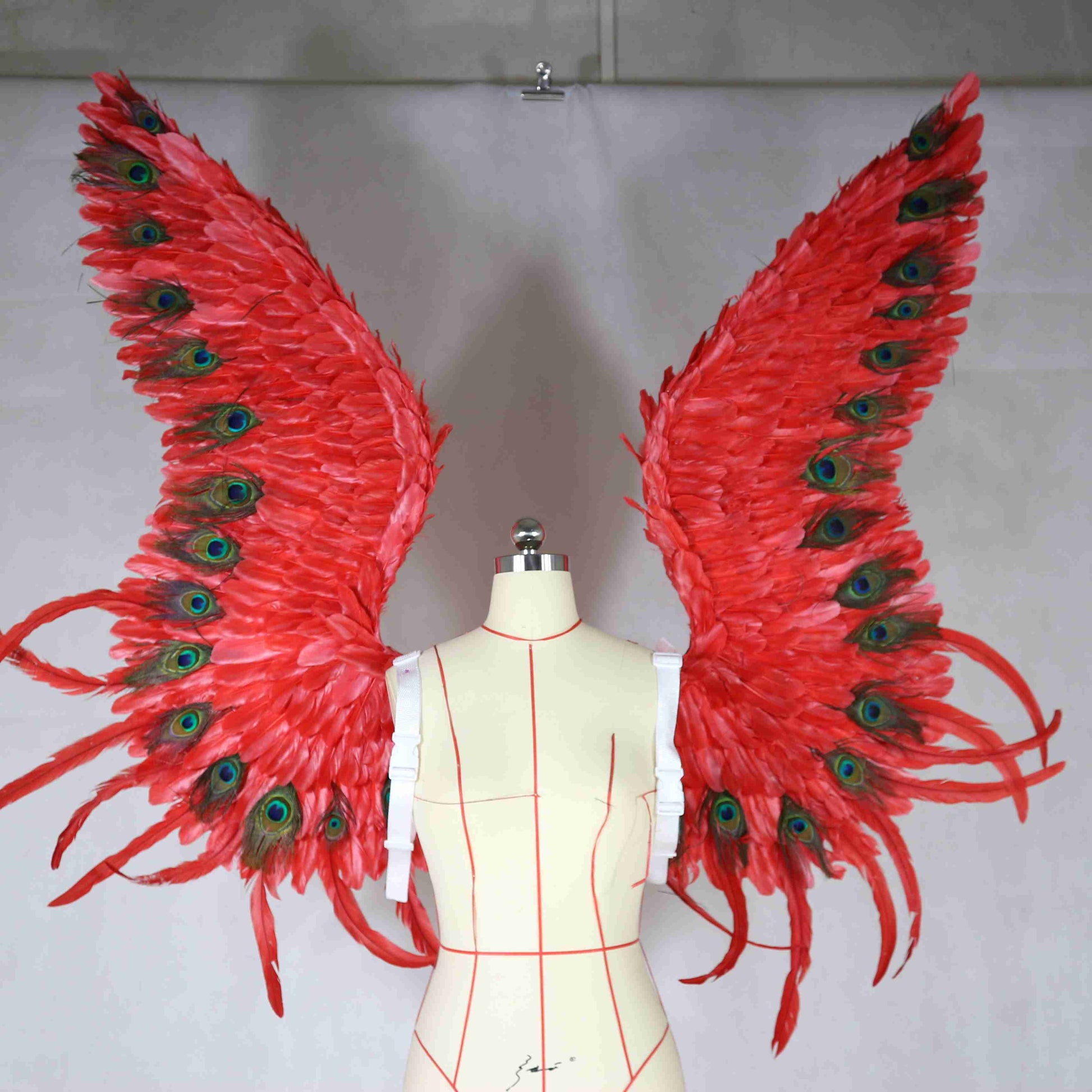 Our red peacock angel wings from the front. Made from goose feathers and peacock feathers. Wings for angel wings costume. Suitable for photoshoots.