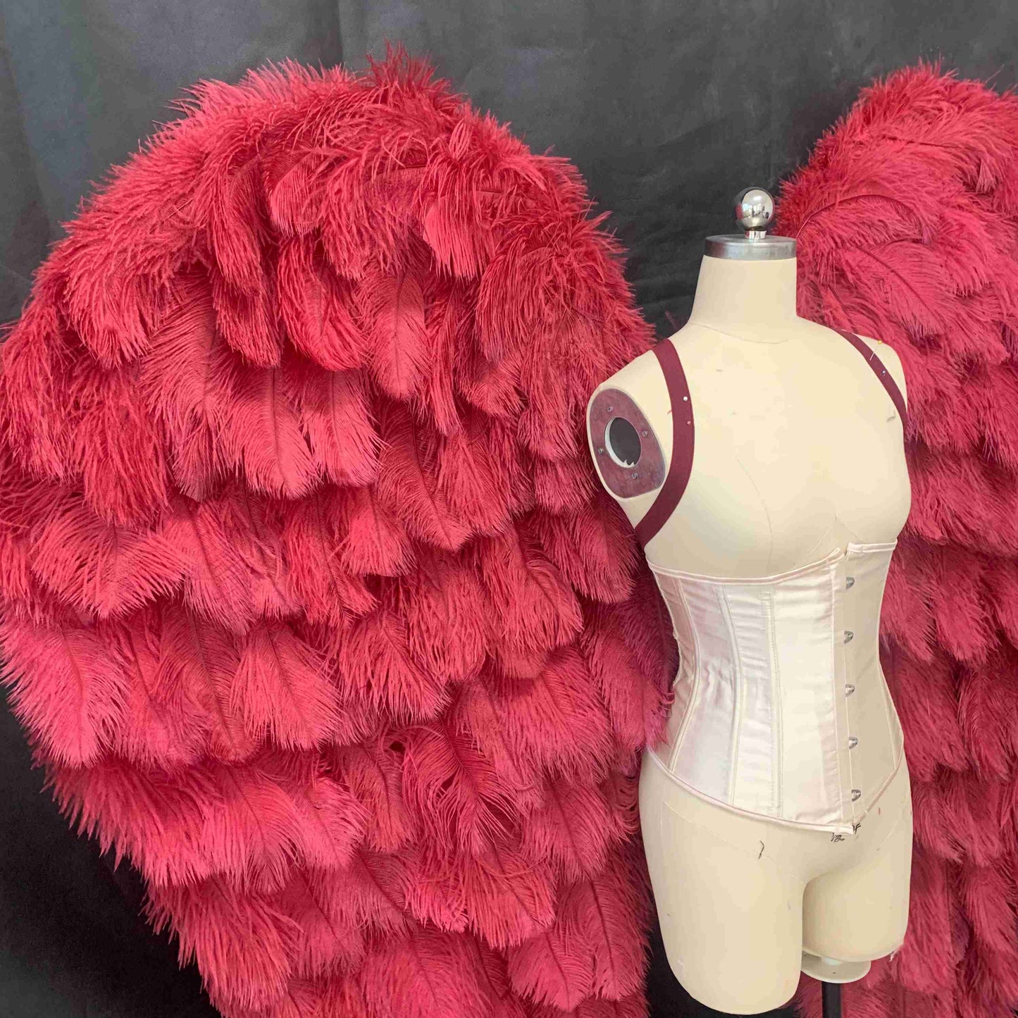 Our luxury red angel wings from the close view. Made from ostrich feathers. Wings for angel costume. Suitable for photoshoots especially for boudoirs.