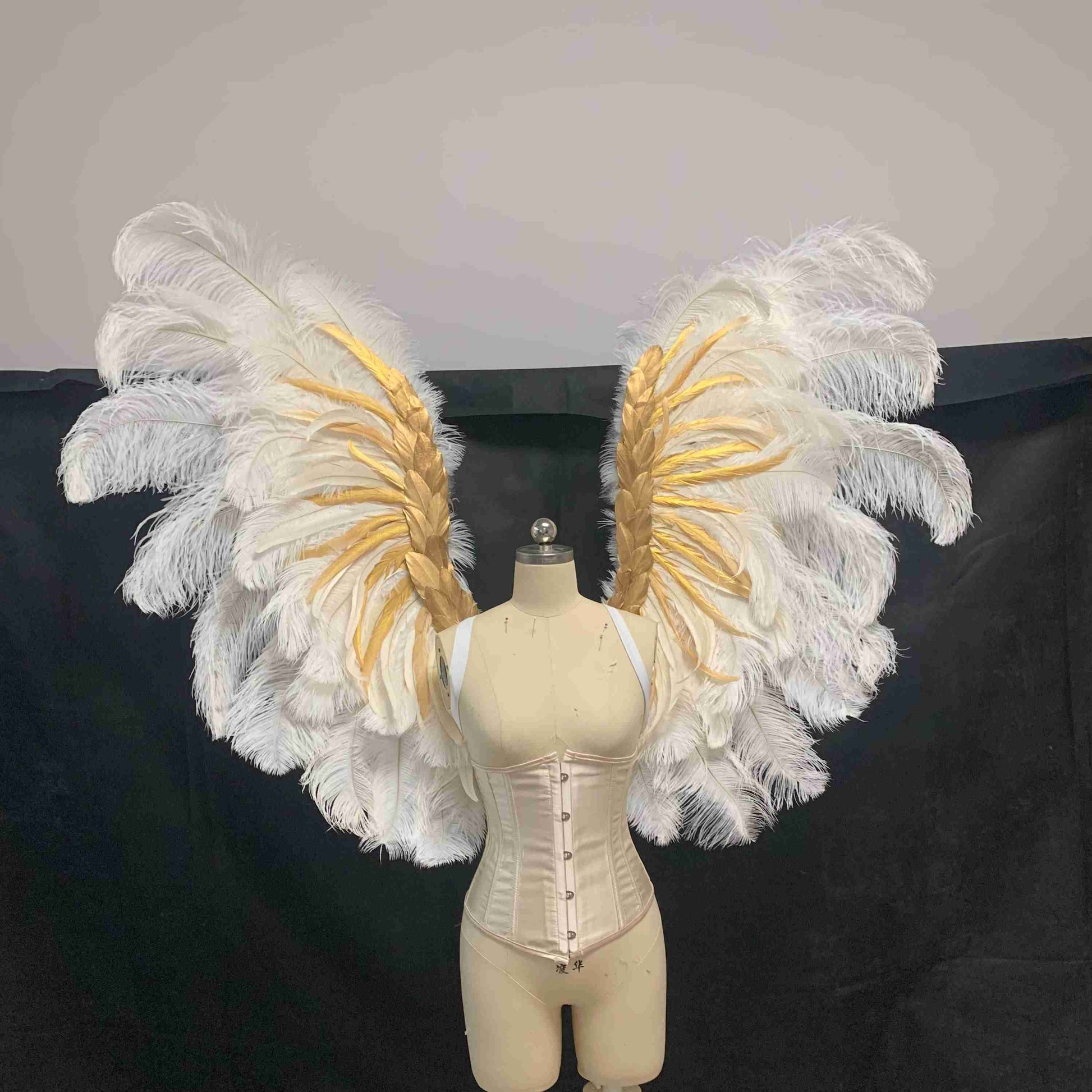 Our white angel wings from the front. Made from ostrich feathers. Wings for angel costume. Suitable for boudoir photoshoots.