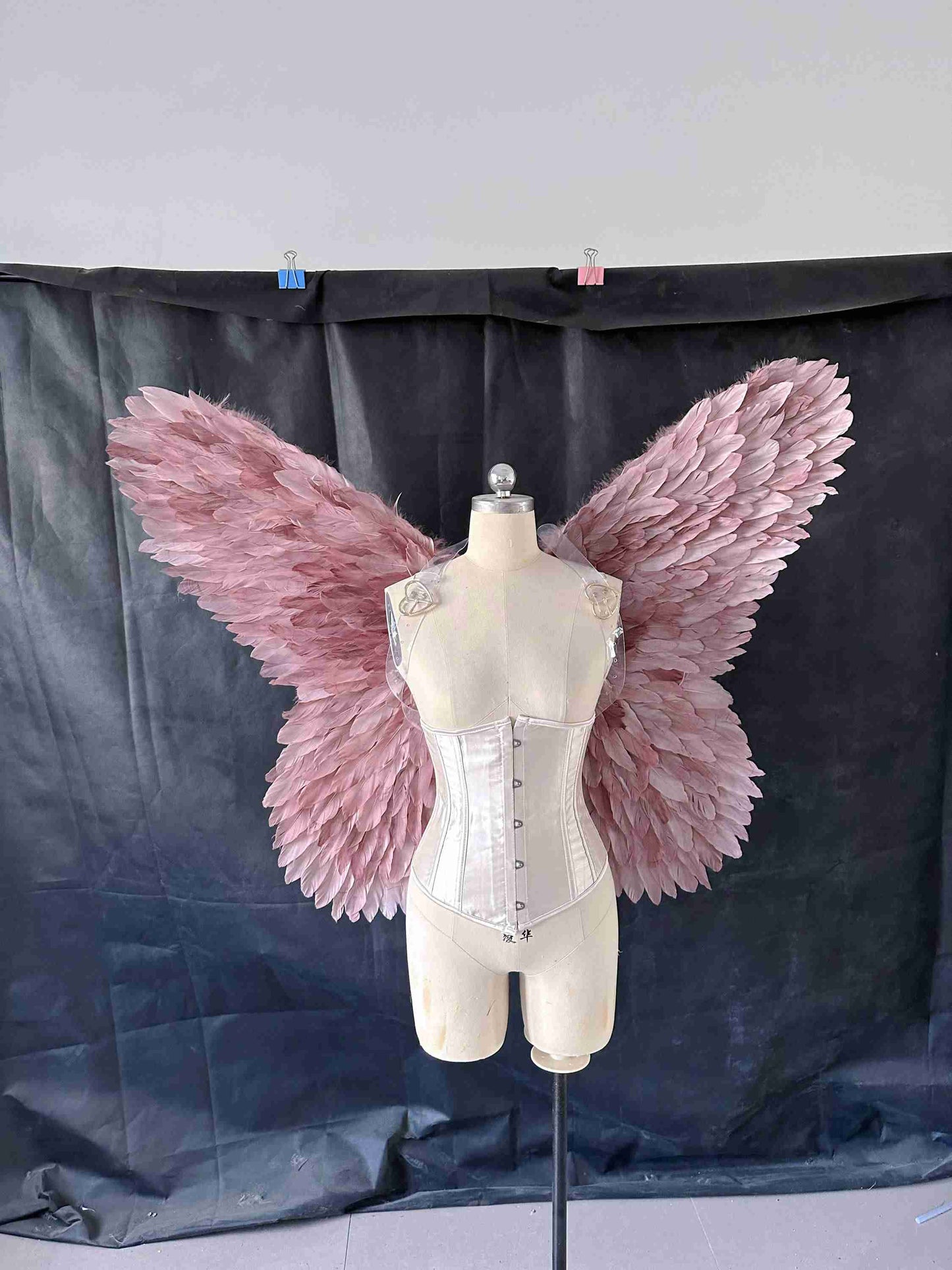 Our small purple color butterfly wings from the front. Made from goose feathers. Wings for butterfly, pixie, and fairy costumes. Suitable for photoshoots.