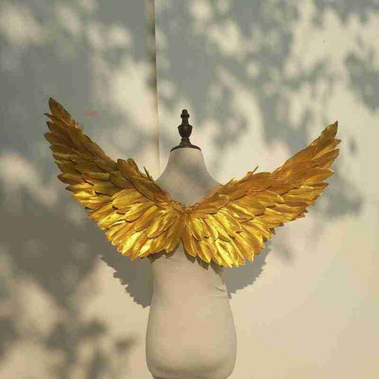 Our little cute golden angel wings from the back. Made from goose feathers. Wings for angel costume or kids wings costume. Suitable for photoshoots.