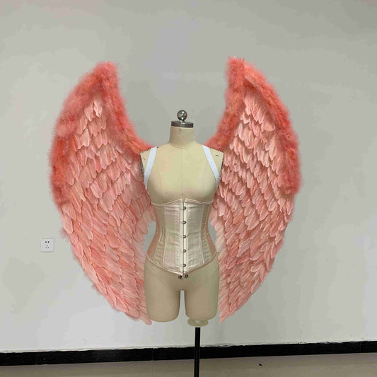 Our small pink color angel wings from the front. Made from goose feathers. Wings for angel costume. Suitable for photoshoots.